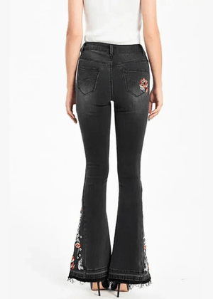 Broderade svarta flare jeans med blommönster