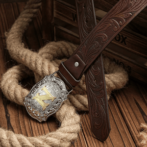 Cowboybälte med gyllene bokstav