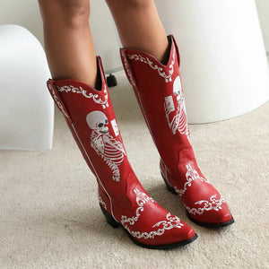 Cowboyboots med broderad skelettdesign och chunky klack