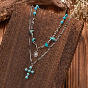 Flerradigt halsbandsset i western stil med turkoskors och choker