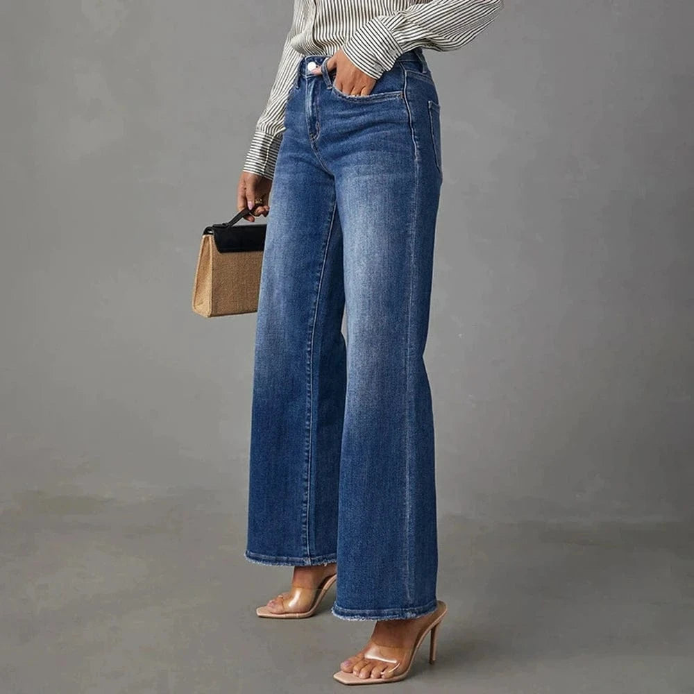 Högmidjade mörkblå vida jeans för dam