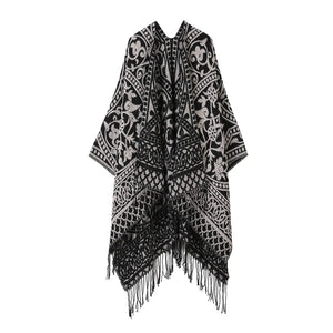 Öppen poncho med blommigt jacquardmönster
