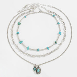 Set med tre silverfärgade westernhalsband med turkos Silver
