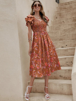 Blommig klänning med volanger