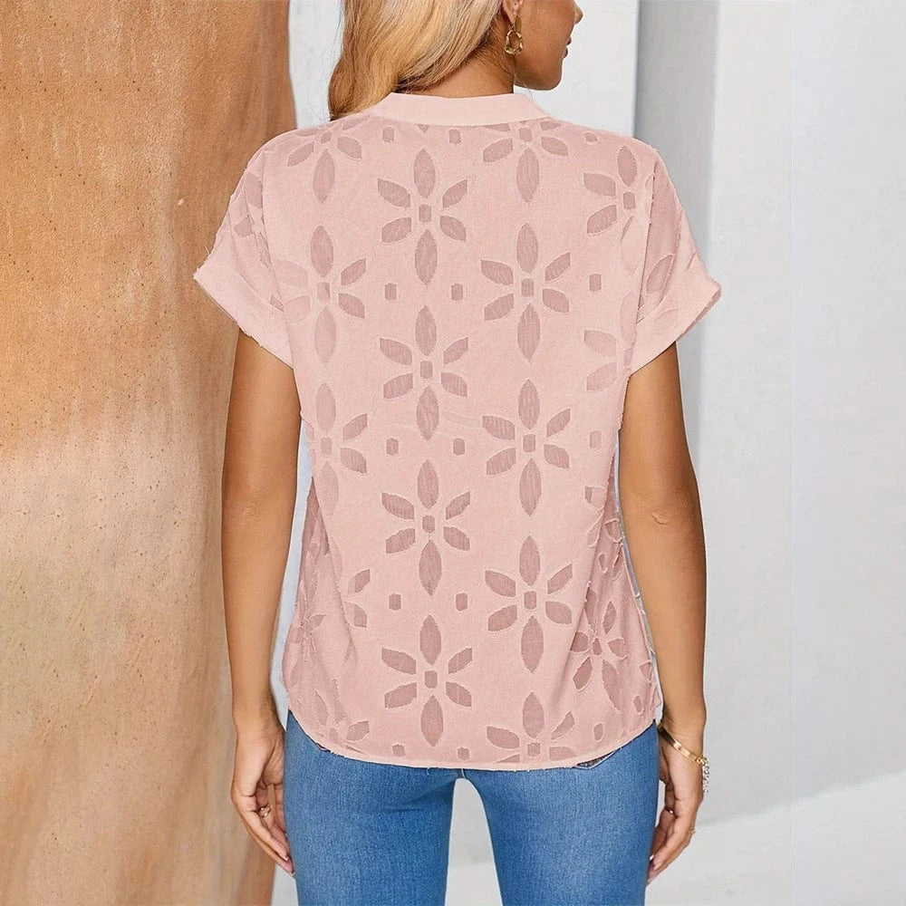 Blus med blommigt hålmönster