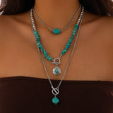 Boho halsband med western-berlocker Silver och turkos