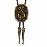 Bolo tie med korslagda revolvrar i metall Antikguld