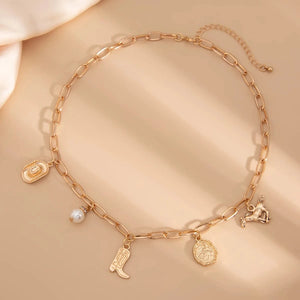 Chunky guldhalsband och armband med western-berlocker