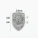 Concho sköldformad med blomgravyr Antik silver