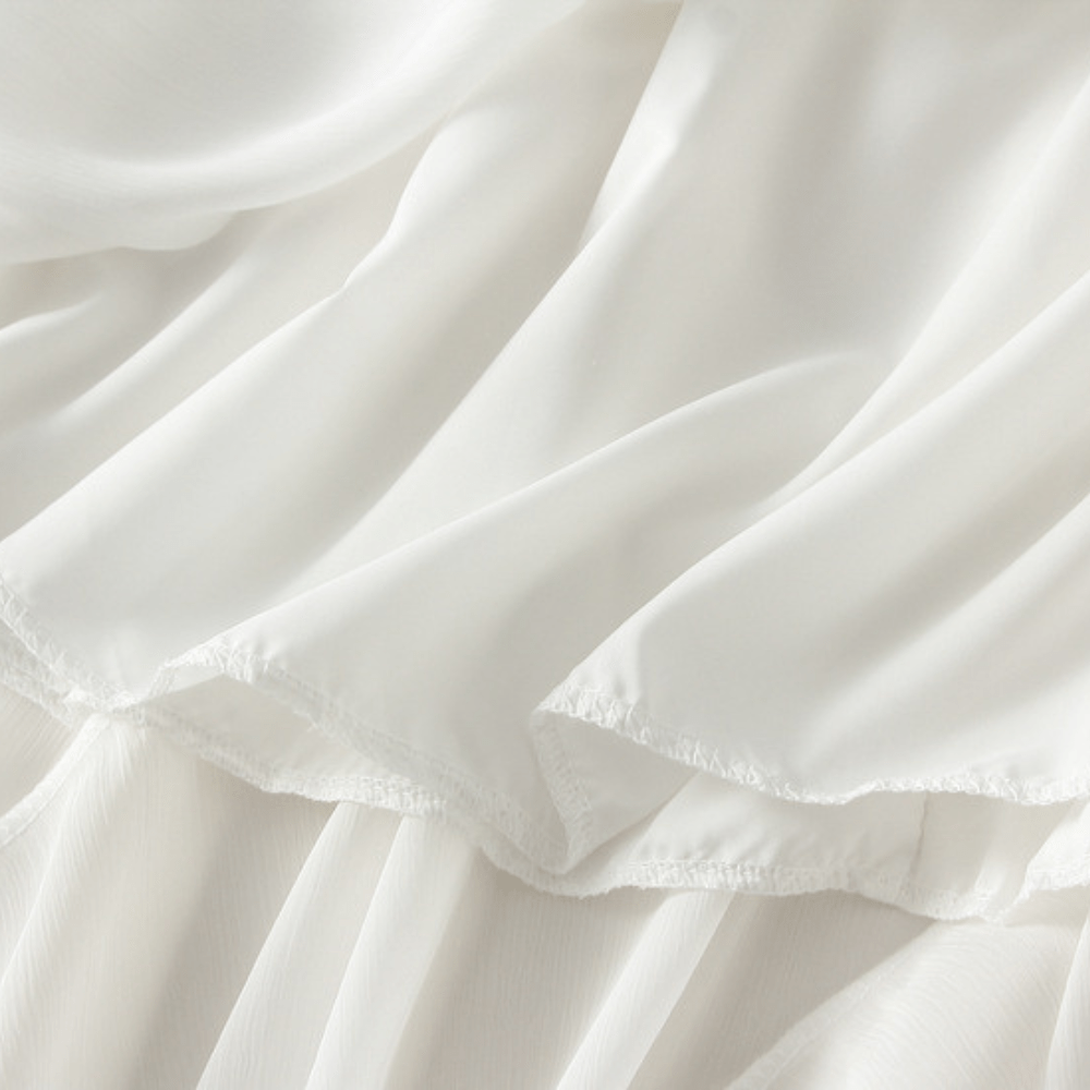 Midikjol med asymmetrisk drapering